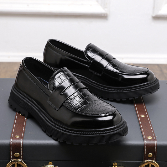 Classic men's slip-on loafers with a polished finish, perfect for dressy or casual everyday wear.