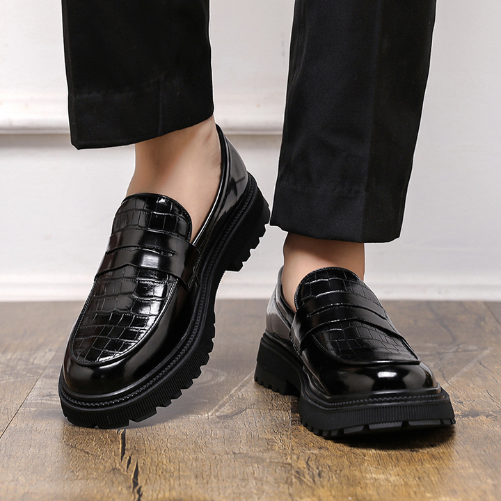 Elegant men's polished slip-on loafers, ideal dress shoes for a smart casual look and everyday comfort.