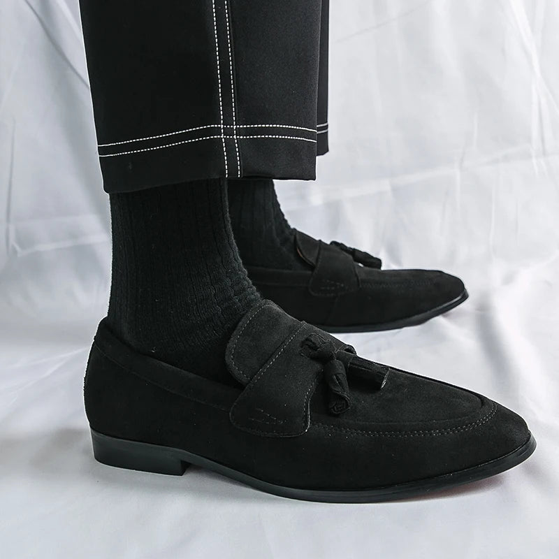 Classic men's tassel loafers, essential elegant slip-on dress shoes for polished business casual looks.