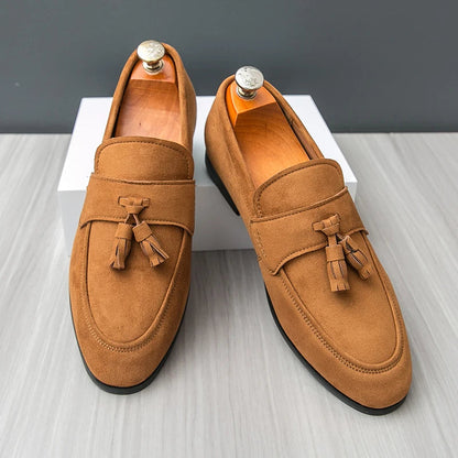 Sophisticated men's slip-on loafers with tassels, perfect formal footwear for stylish menswear.