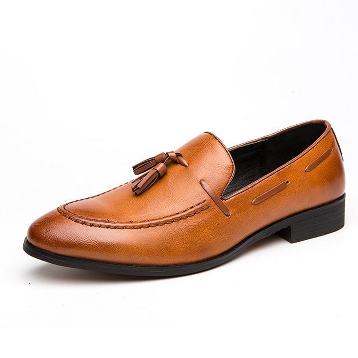 Classic men's black tassel loafers, comfortable, stylish slip-on dress shoes for a professional look.