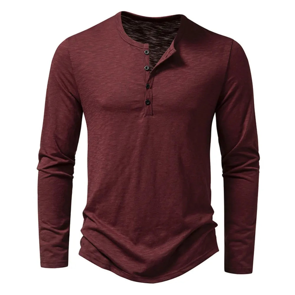 Man relaxing in a cozy slim-fit men's henley top, perfect for leisure and everyday comfort.
