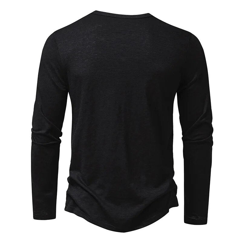 Man wearing a classic slim fit henley with jeans, showcasing a complete casual outfit.