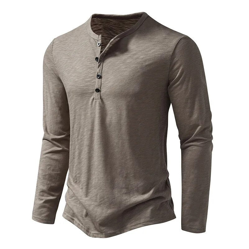 Close-up of the button placket and collar on a stylish men's long sleeve henley shirt.