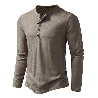 Close-up of the button placket and collar on a stylish men's long sleeve henley shirt.