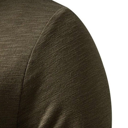 Side view of a man wearing a casual long sleeve slim fit henley, highlighting its flattering cut.