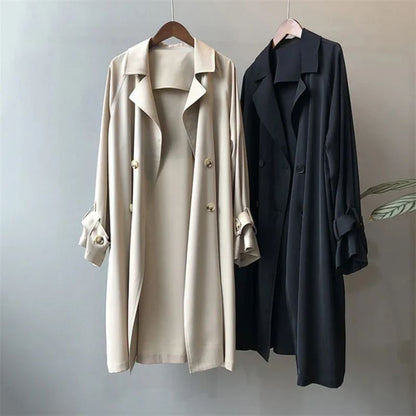 Black elegant women's double-breasted trench coat, a sophisticated fall & spring outerwear fashion staple.