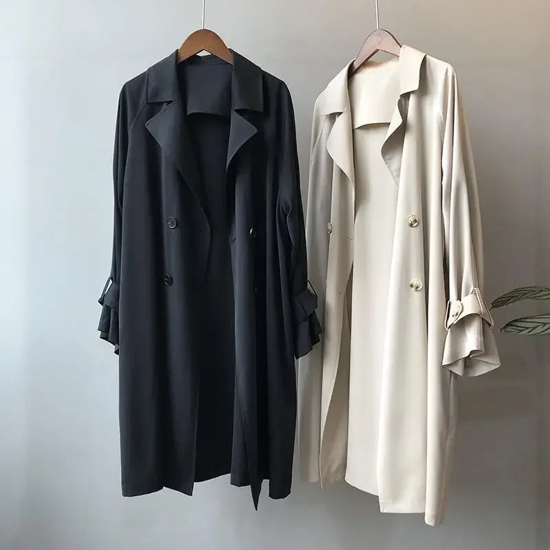 Long classic women's trench coat with double-breasted design, essential elegant outerwear for fall & spring.