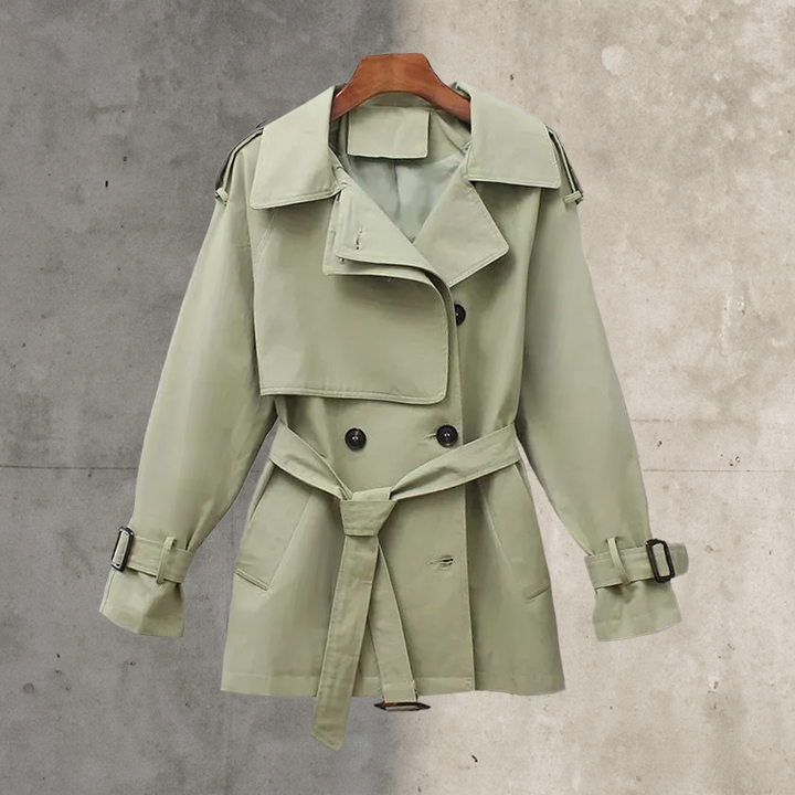 Classic women's double-breasted trench coat with belt. Elegant fall/spring outerwear, timeless style.