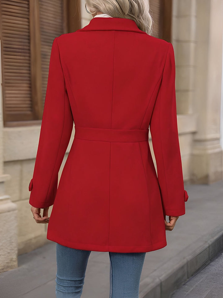 Fashion-forward women's double-breasted trench coat with a cinched belted waist detail.