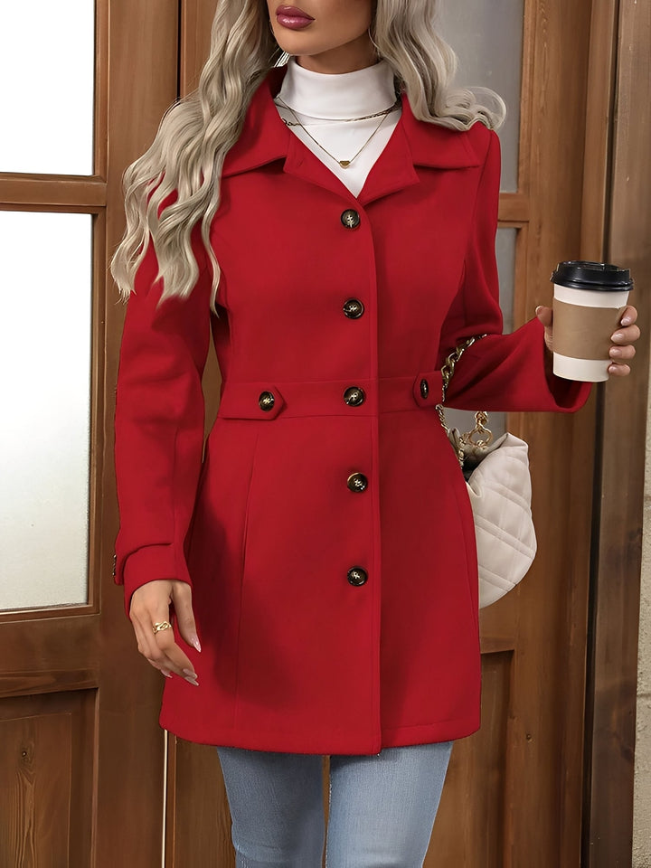 Classic women's trench coat, double-breasted closure and elegant belt for a polished look.