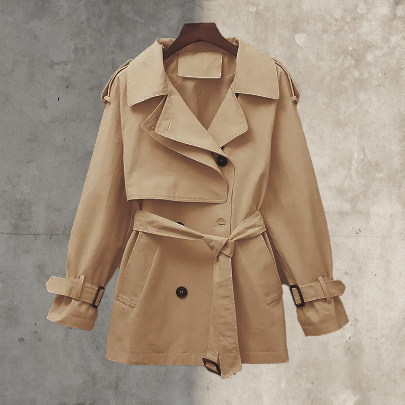 Stylish belted women's trench coat. Long, double-breasted transitional jacket for fall & spring fashion.