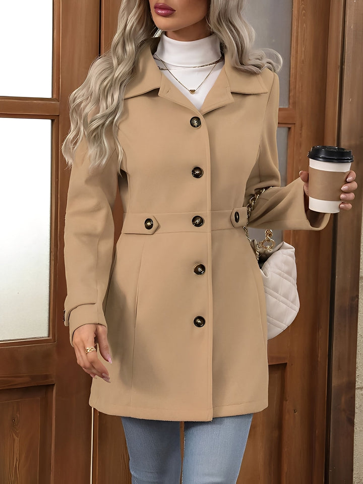 Stylish women's belted trench coat, a classic double-breasted outerwear piece for transitional weather.