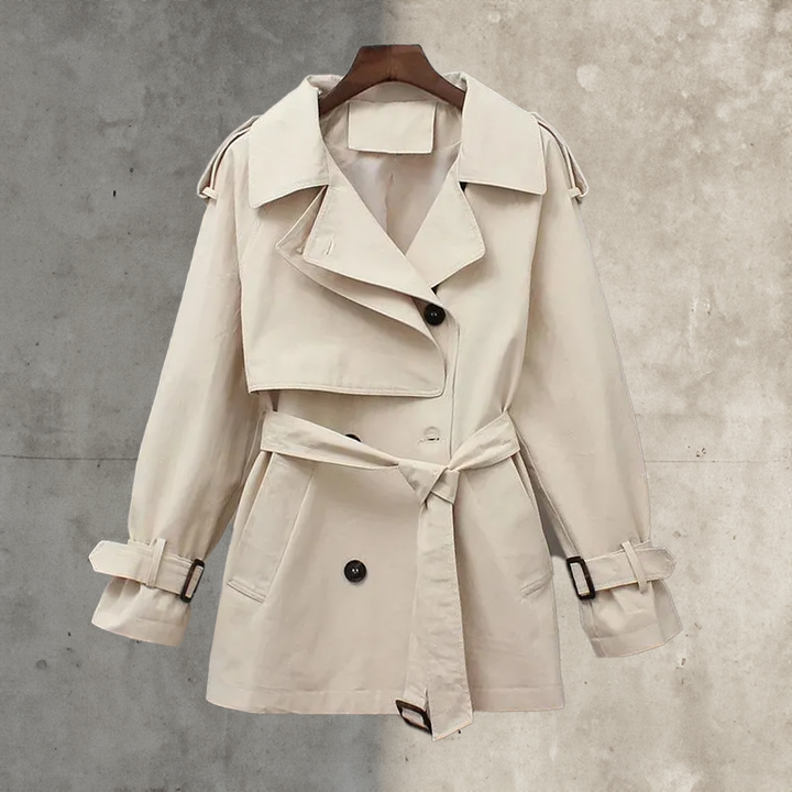 Timeless women's double-breasted trench coat with adjustable belt. Elegant fall/spring outerwear.