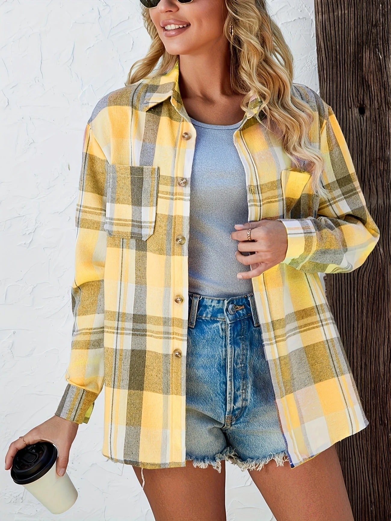 Versatile women's plaid button-down top, open style, perfect for layering over a tank.
