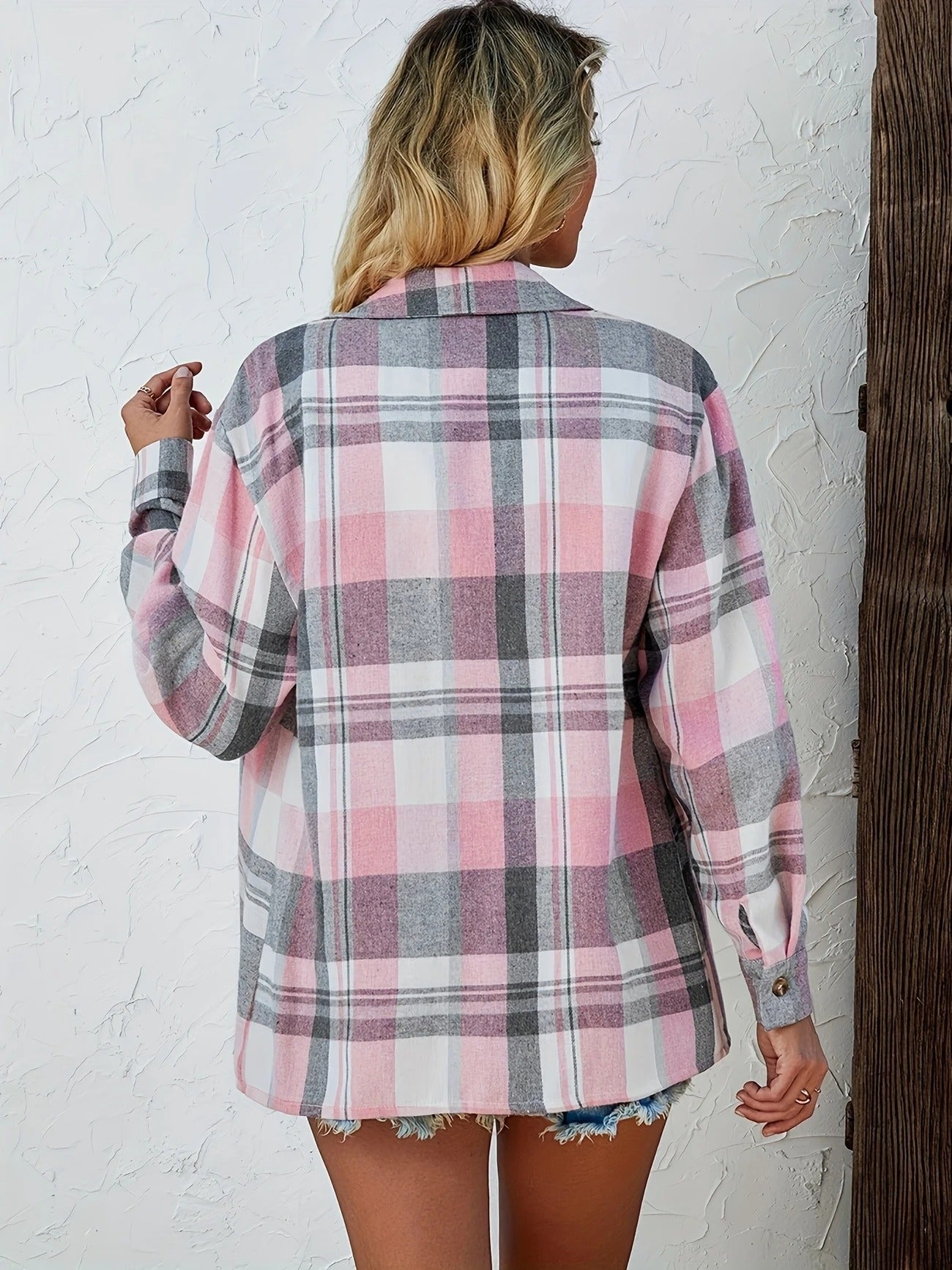 Women's casual plaid button-down shirt, unbuttoned over a tee, perfect versatile style.