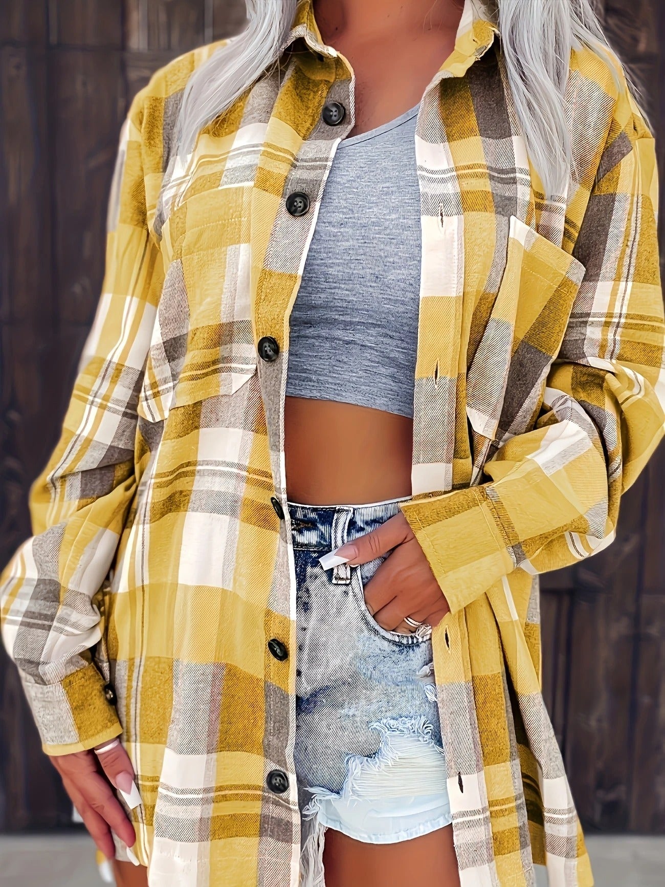 Women's everyday wear plaid button-down, long sleeves, with front pockets and collar detail.