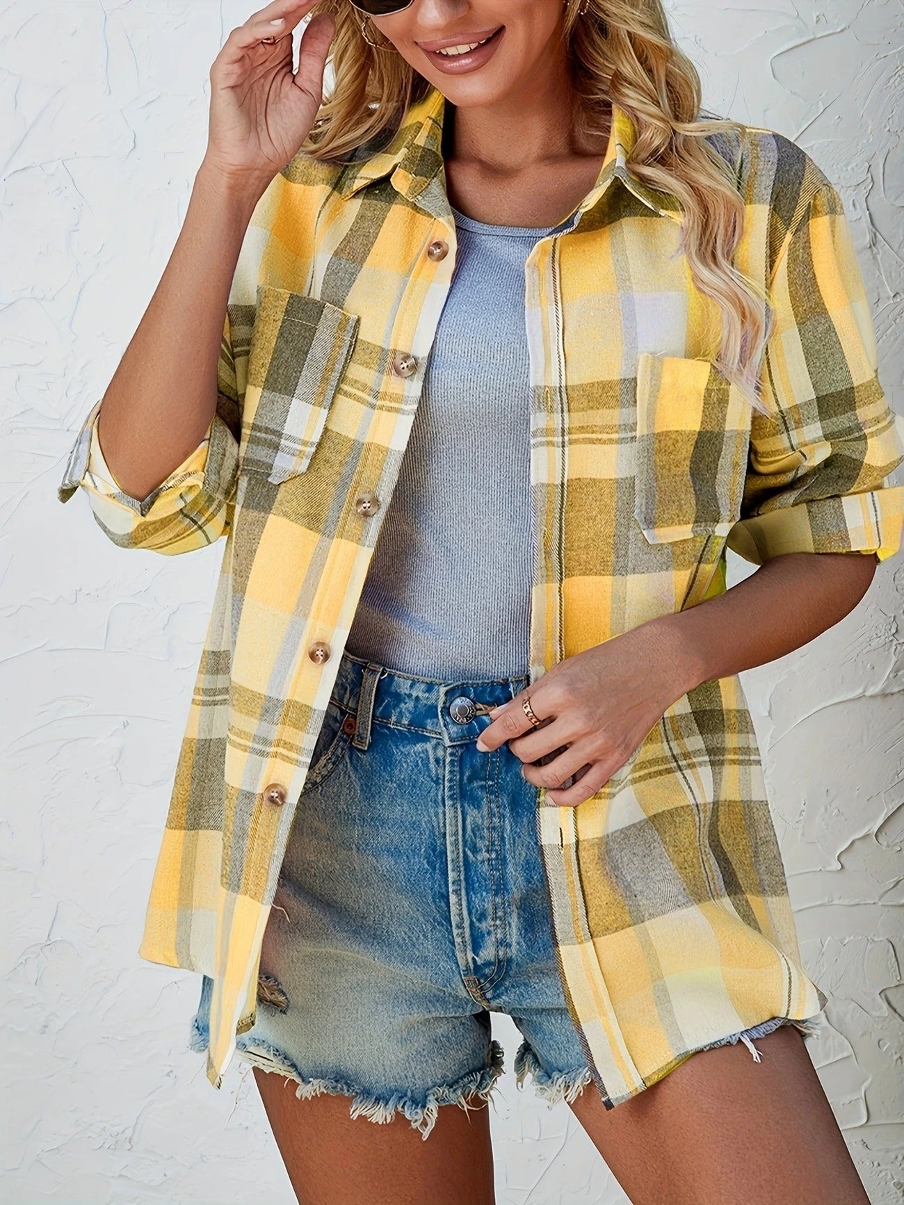 Stylish women's button-down plaid shirt, perfect for fall fashion, casual yet chic.