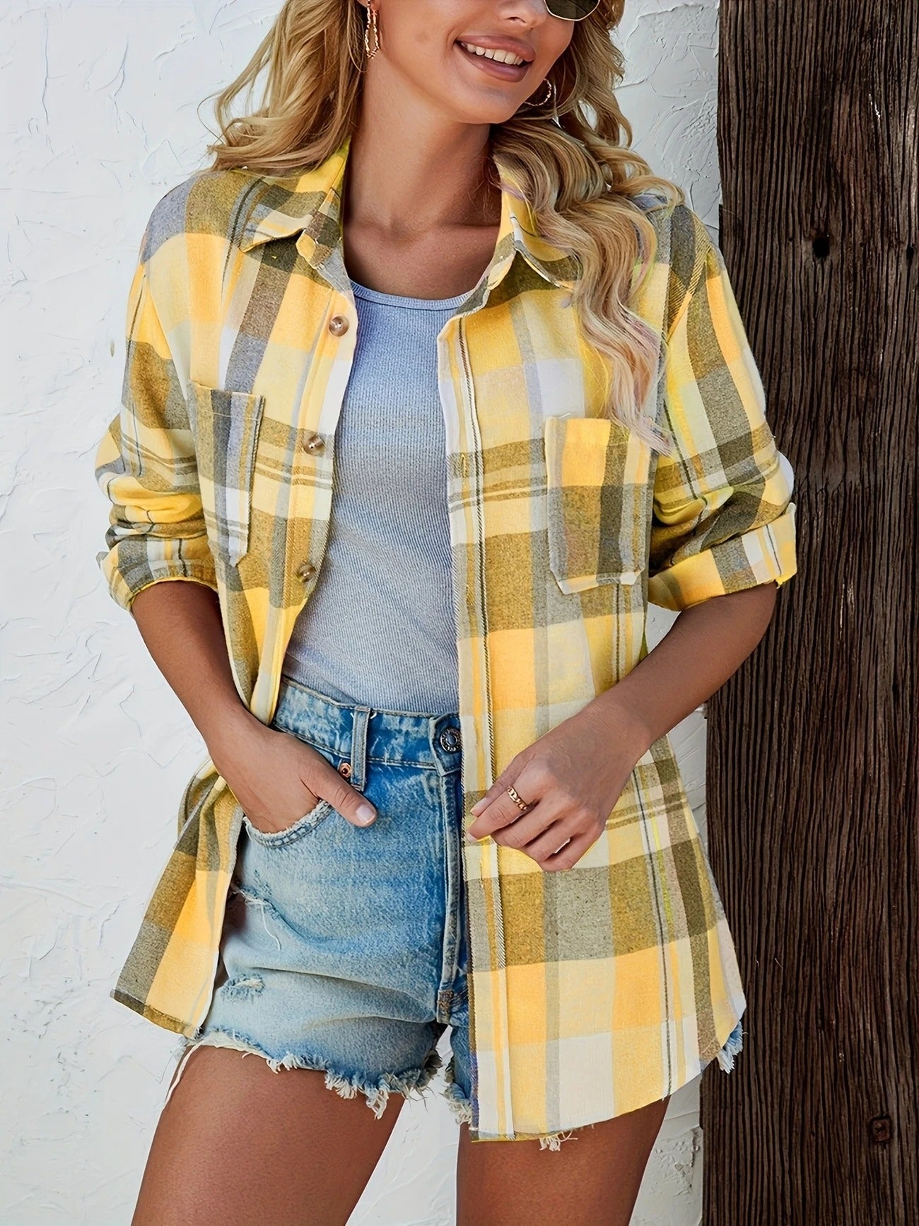 Comfortable women's long sleeve plaid shirt, buttoned up, ideal for a smart casual look.