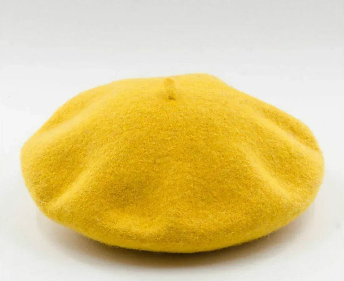 French style women's wool beret. Warm and chic winter hat for ladies.