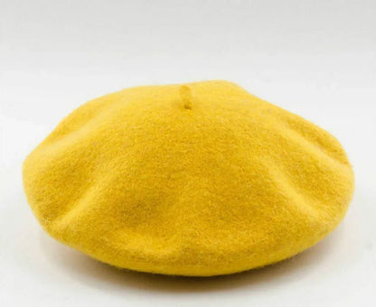 French style women's wool beret. Warm and chic winter hat for ladies.