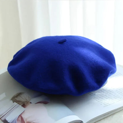 Warm ladies' classic beret. Elegant wool hat, perfect for cold weather fashion.