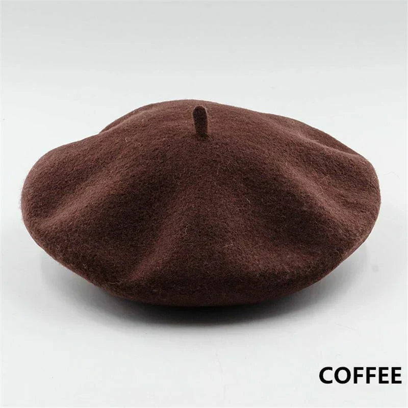 Fashionable black wool beret for women. French style, warm winter hat.