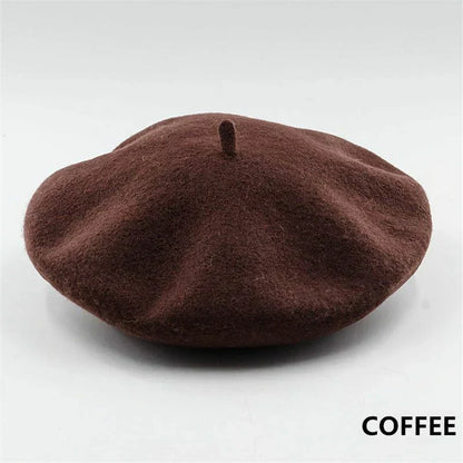 Fashionable black wool beret for women. French style, warm winter hat.
