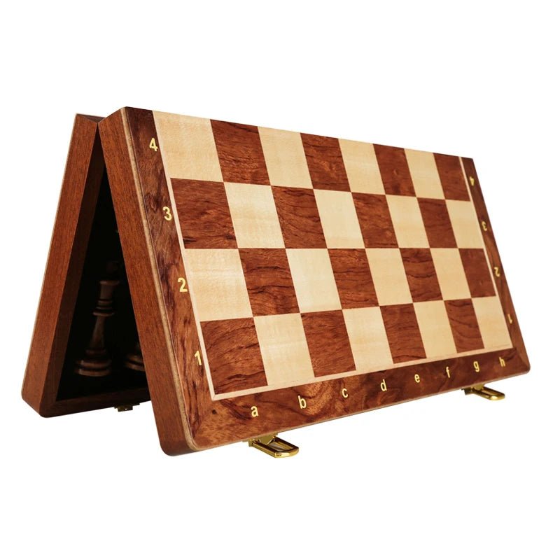 Complete wooden chess set featuring a foldable walnut board and weighted chess pieces for play.