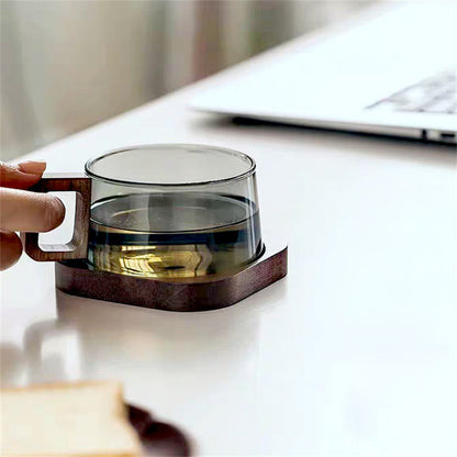 Stylish glass coffee mug featuring a unique cedar handle. Ideal borosilicate drinkware for kitchen & home.