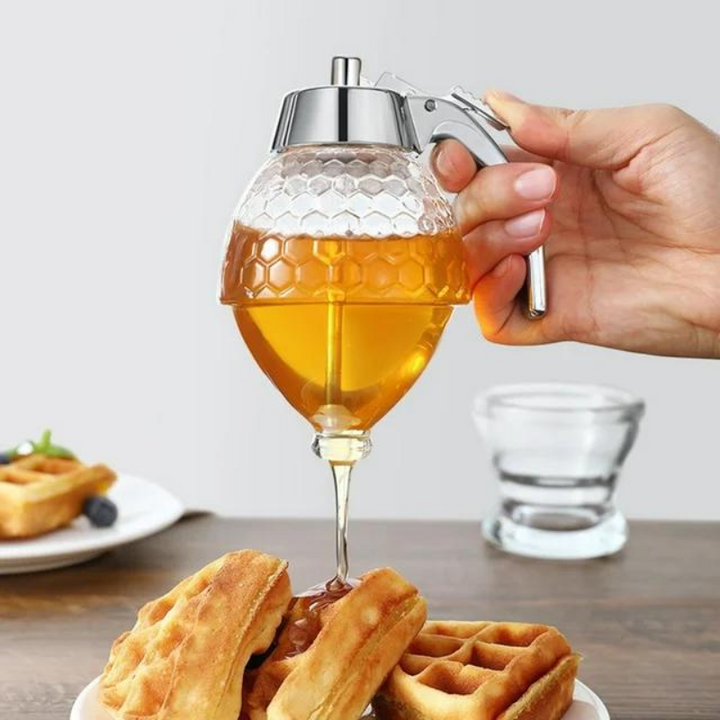 Clear plastic drip-free honey dispenser for kitchen & table, prevents sticky mess.