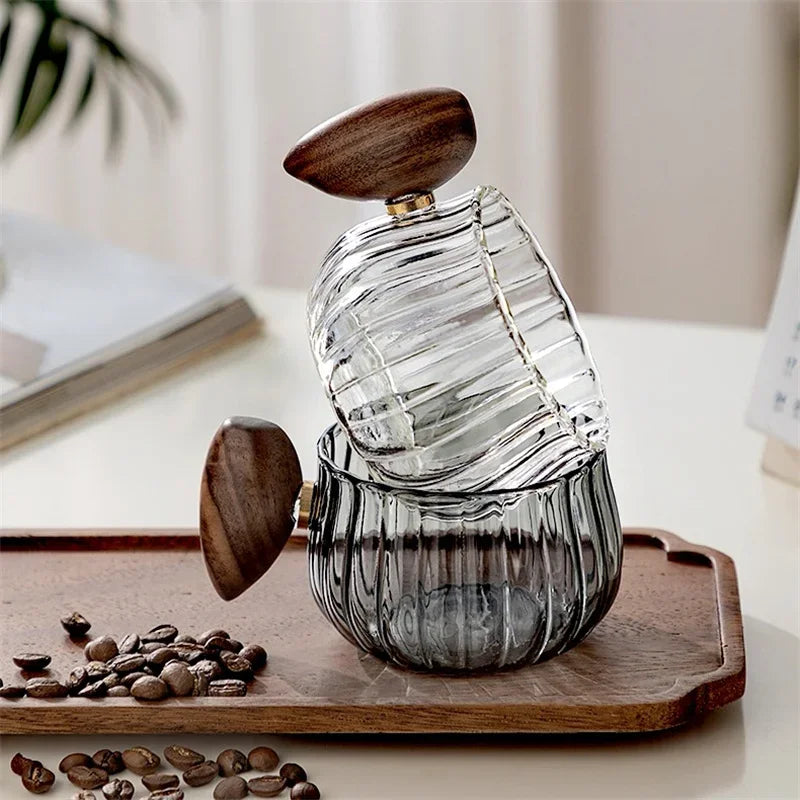 Unisex 8 fl oz clear glass mug, textured design & wooden handle for hot/cold beverages.