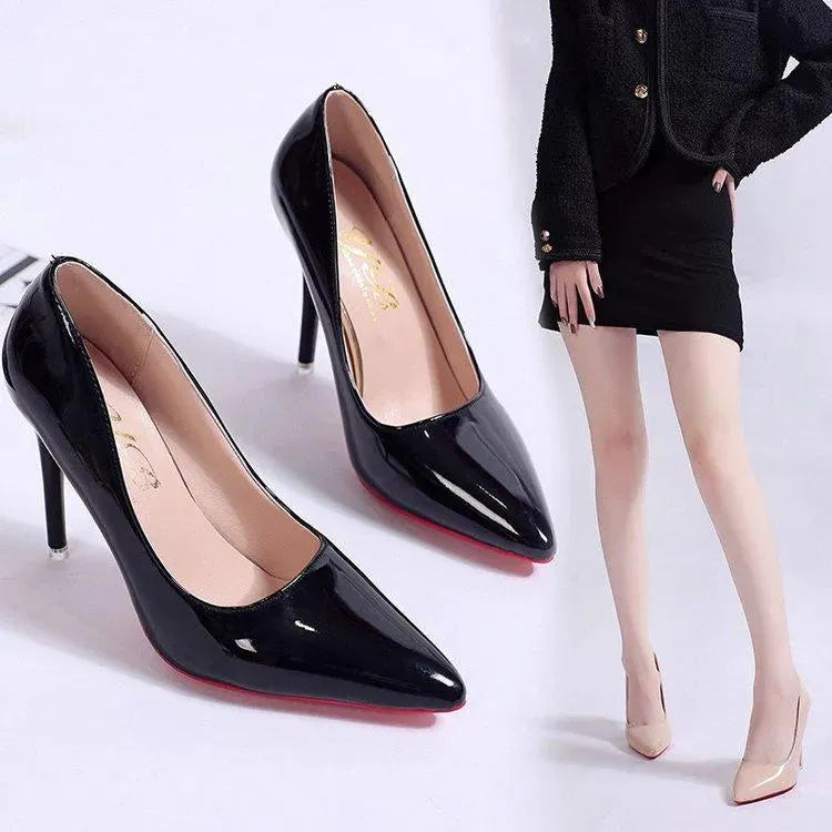 Close-up of a black classic stiletto pump with pointed toe, perfect for office wear & parties.