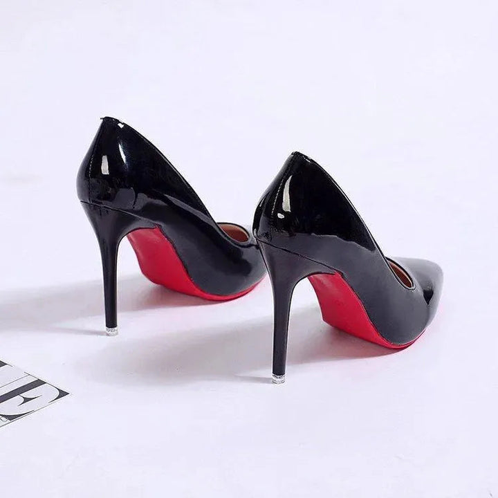 Elegant black high-heel stiletto pumps, women's dress shoes, formal footwear with sleek design.