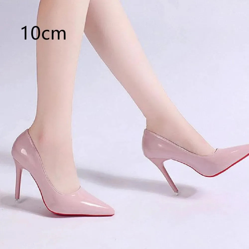 Shiny black leather stiletto pumps, women's pointed-toe dress shoes for an elegant look.