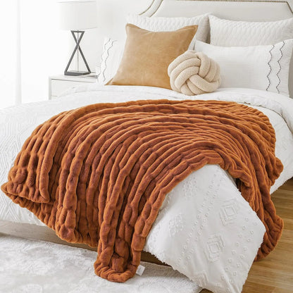 Decorative soft blanket made of luxurious faux rabbit fur, enhancing a stylish living area.