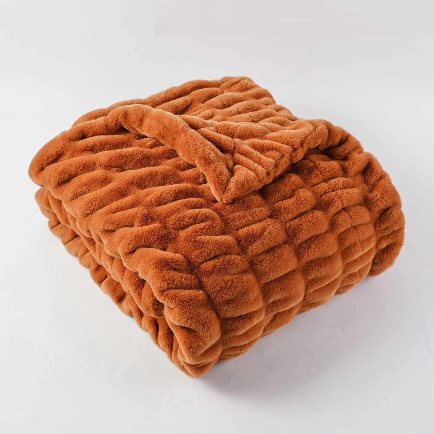 Decorative faux fur blanket, offering a plush, soft texture & luxurious feel for modern home decor.