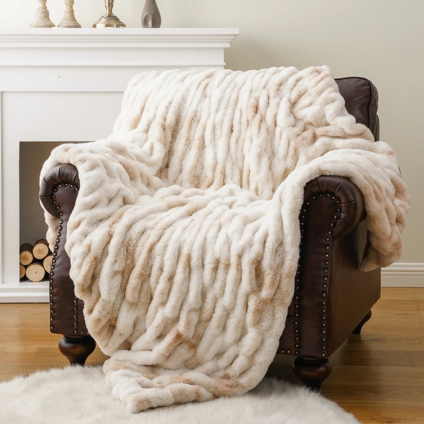 Elegant faux fur throw blanket, perfect for adding cozy luxury & warmth to any home decor.