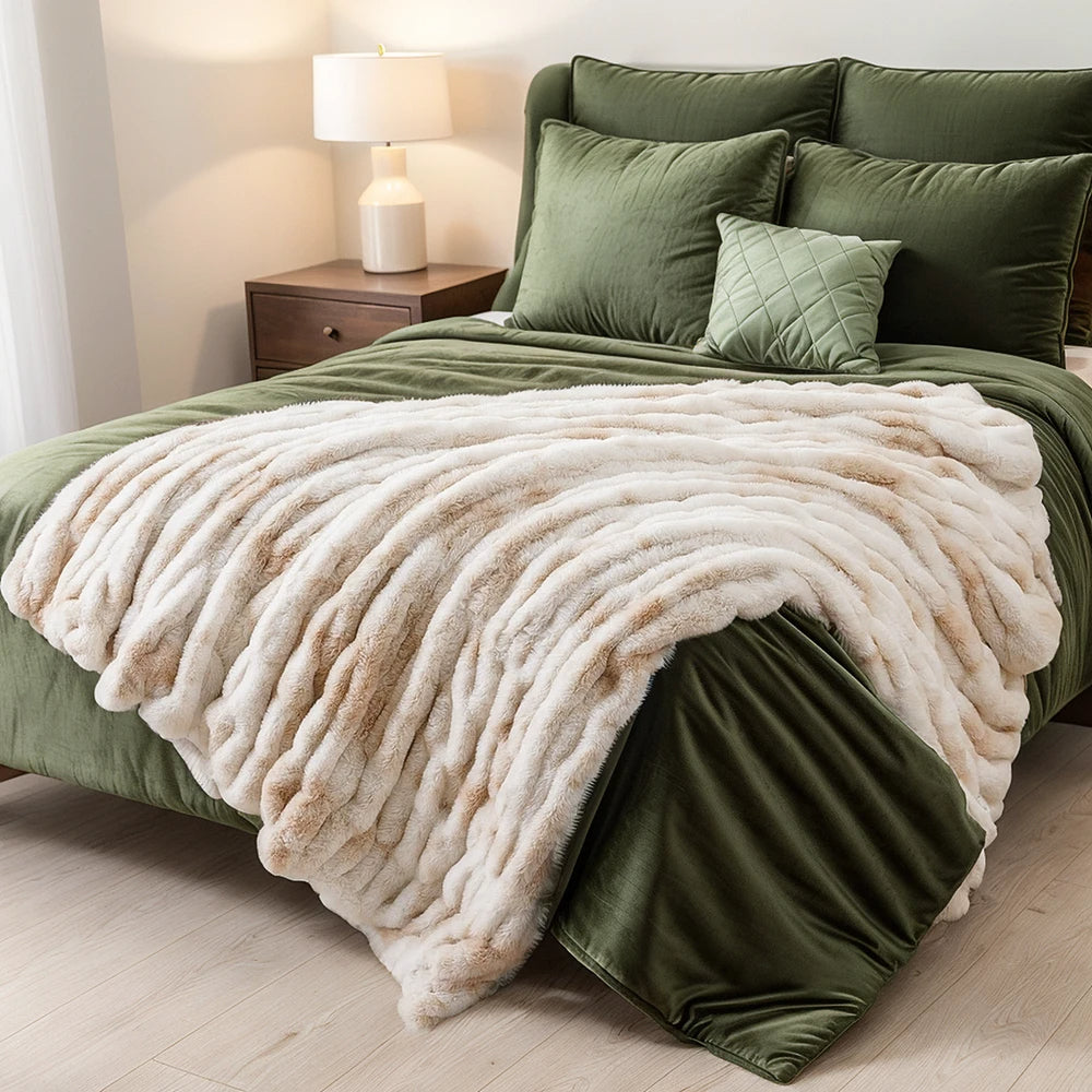 Soft plush faux rabbit fur throw blanket draped on a sofa, enhancing a cozy living space.