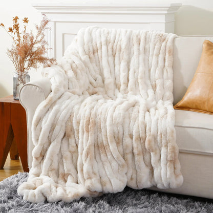 Decorative faux fur throw blanket in a neutral tone, ideal for stylish home decor & comfort.