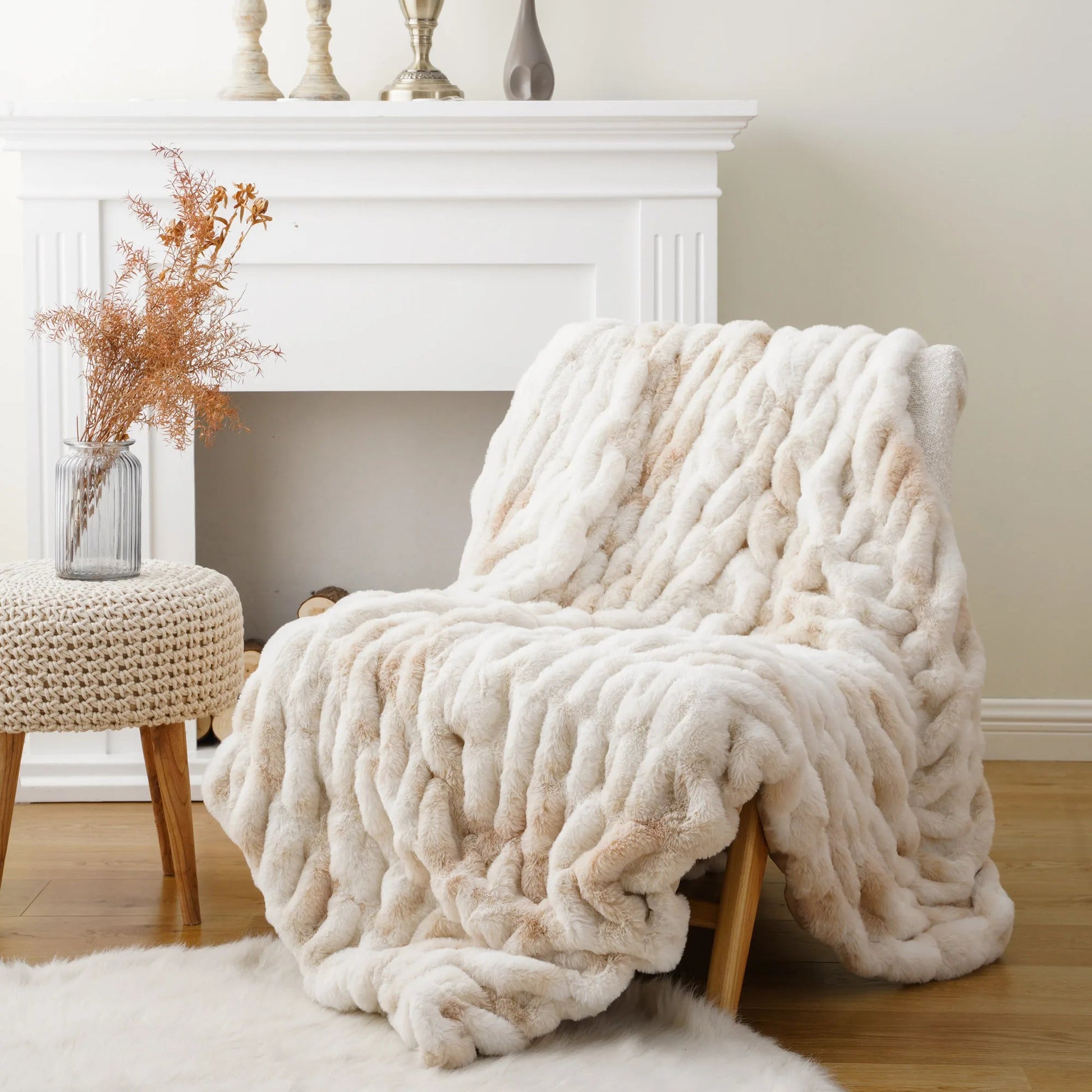 Textured faux fur throw blanket, offering a soft, plush feel & sophisticated home decor style.