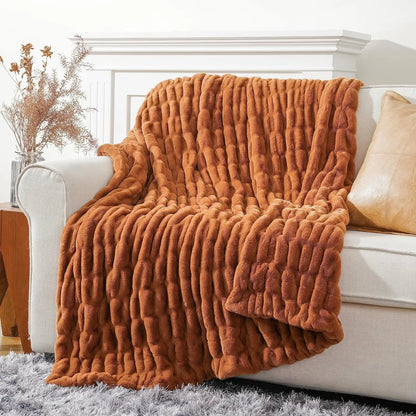 Stylish faux rabbit fur throw blanket, ideal for adding warmth, luxury, & a soft touch to home decor.