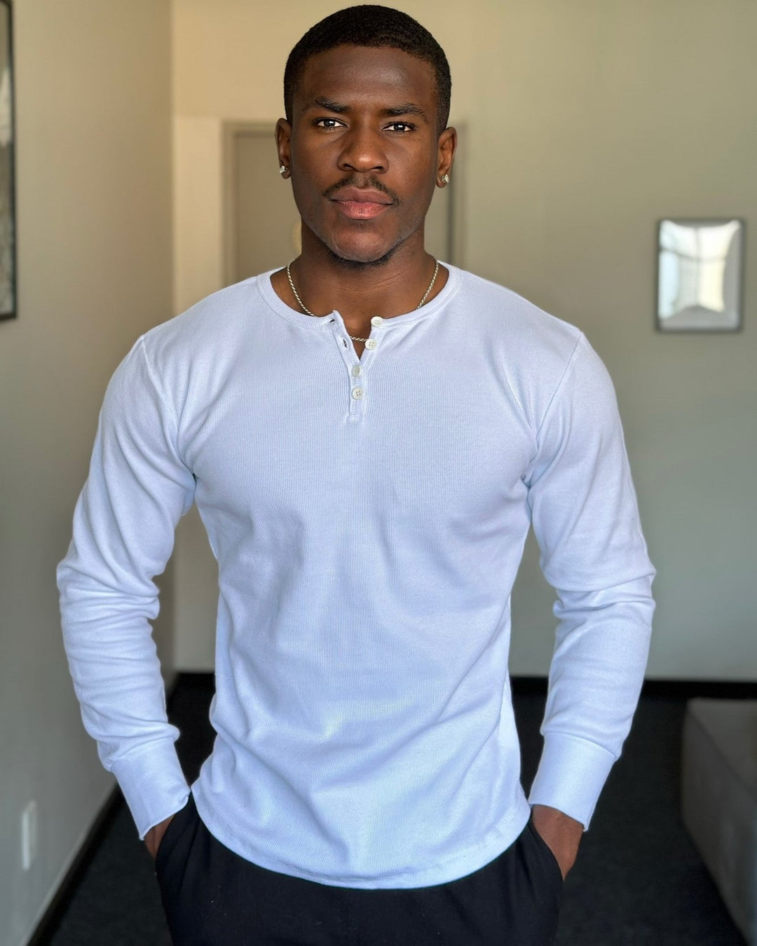 Close-up of the Siena Ribbed Henley's unique ribbed texture & durable stitching.