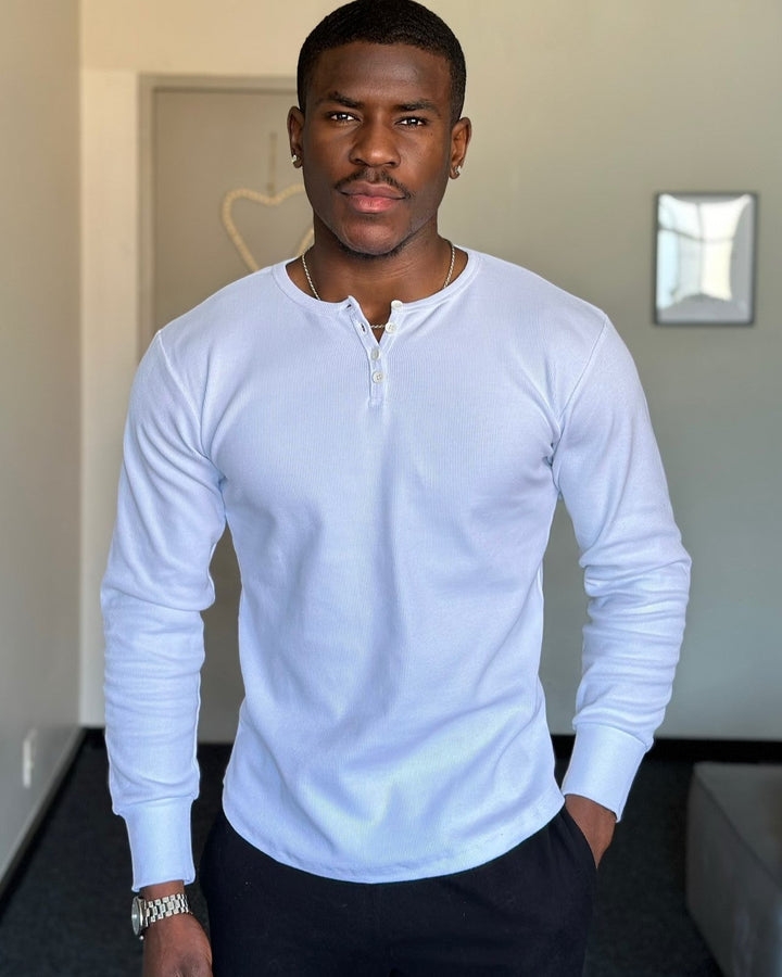 Men's Siena Ribbed Henley on a hanger, showcasing its timeless design & quality.