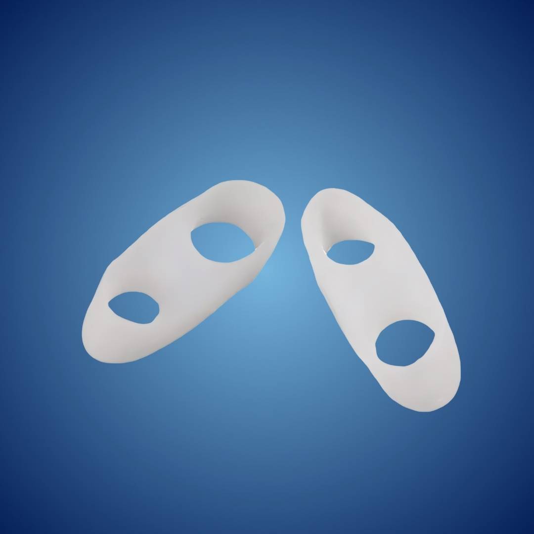 Unisex orthopedic toe spacers, visible on feet, correcting bunions and providing pain relief.