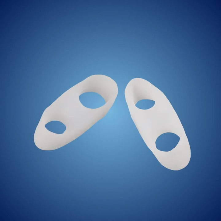 Unisex orthopedic toe spacers, visible on feet, correcting bunions and providing pain relief.