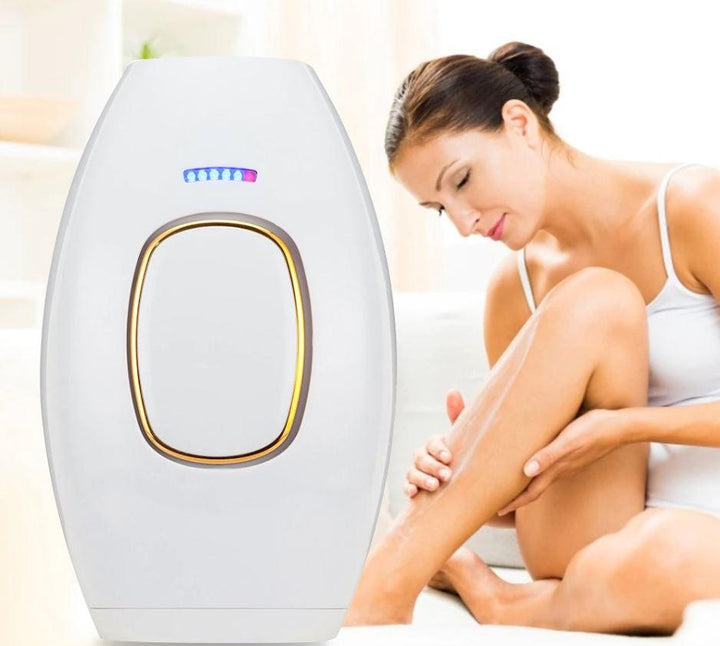 Woman holding the At-Home Laser Hair Removal Handset on her leg for smooth, hair-free skin.