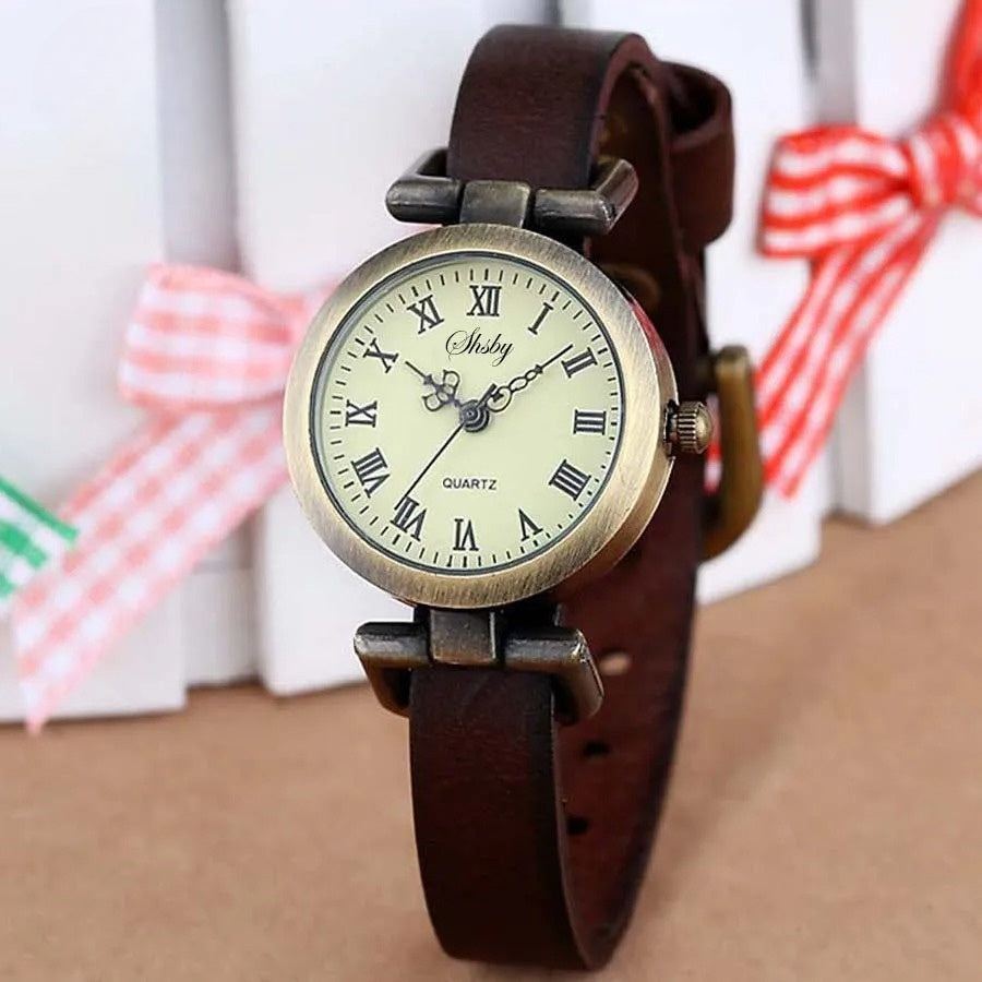 Close-up of Women's Classic Vintage Quartz Watch with brown leather strap, round dial.