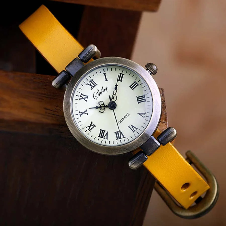 Fashionable women's quartz timepiece, vintage-inspired design, comfortable leather wristband.