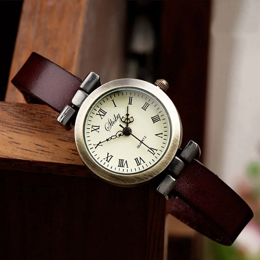 Antique-style women's watch, quartz movement, with genuine black leather strap.
